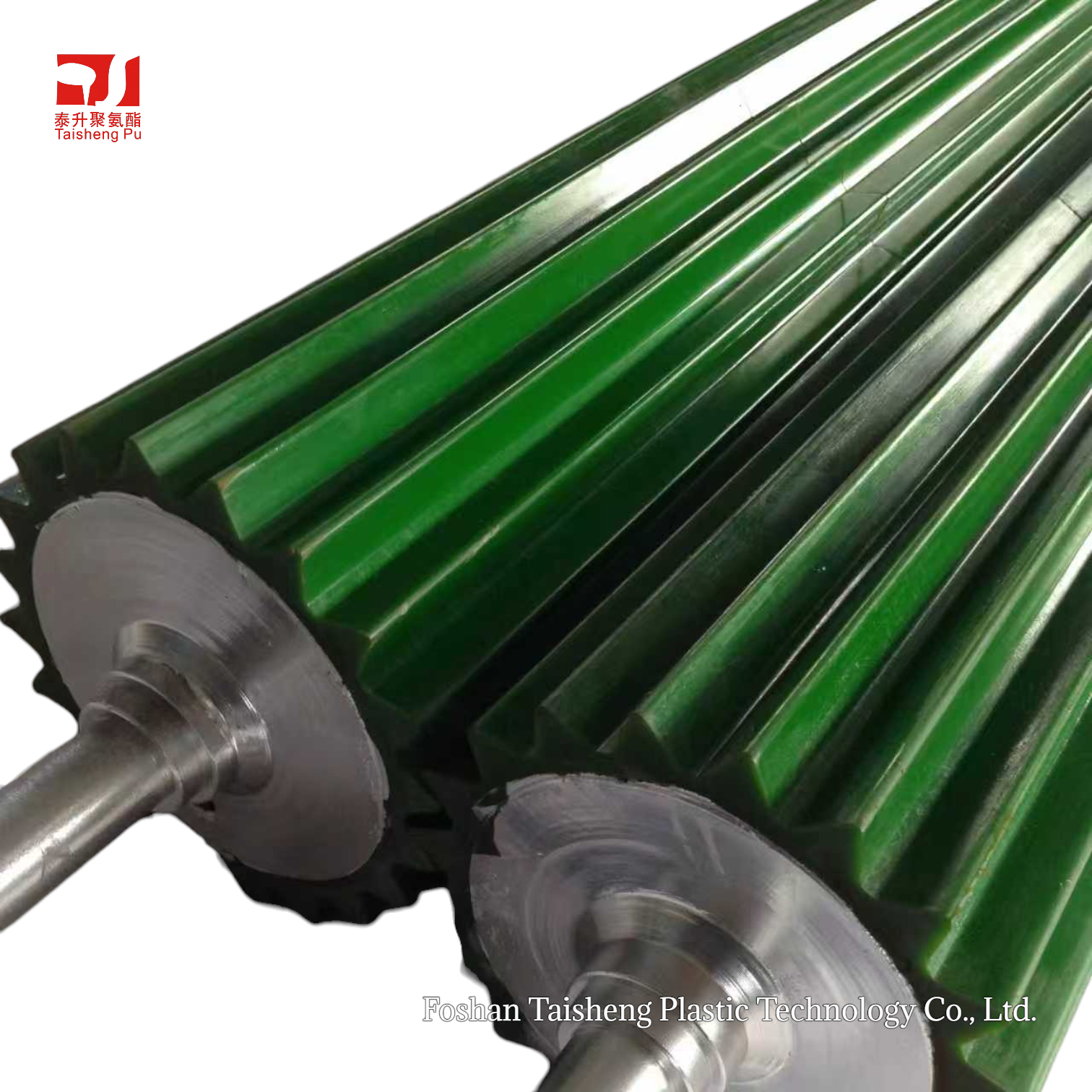 Green polyurethane slotted rollers mounted on metal shafts