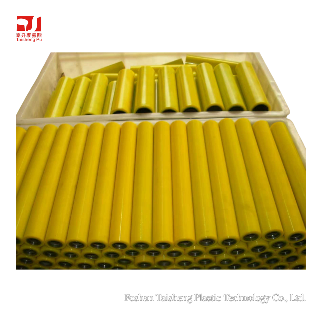 Batch of precision-molded yellow polyurethane rollers.