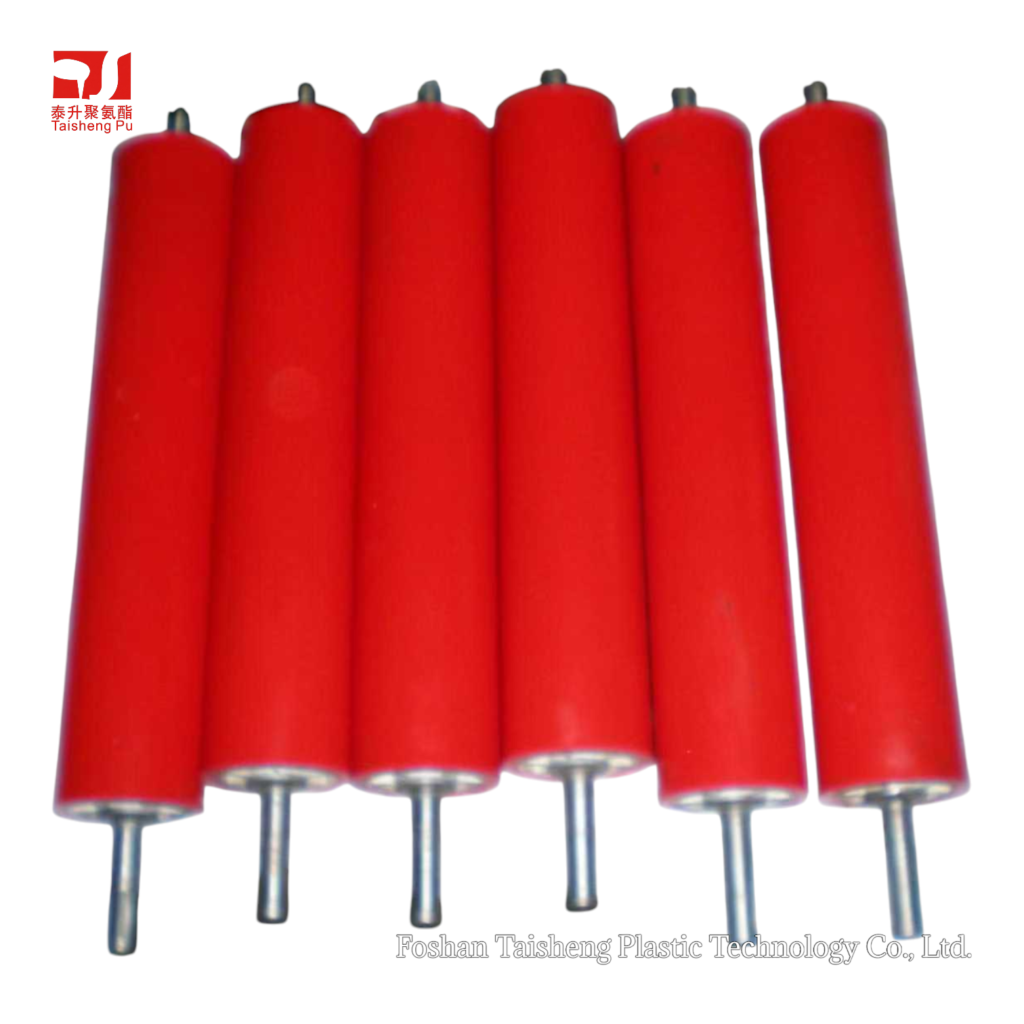 Array of red polyurethane feed rollers, non-marking and superior to rubber rollers in oil resistance.